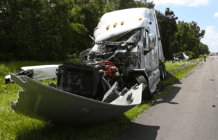 A man was killed and six were injured after a tractor trailer hit an RV that had pulled onto the shoulder of the interstate.