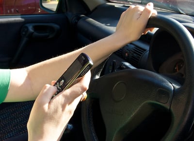 person driving while texting